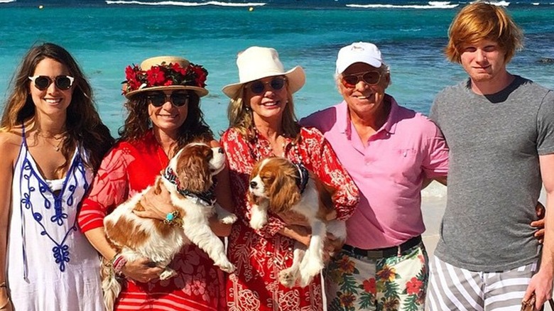 The Buffett family posing on beach