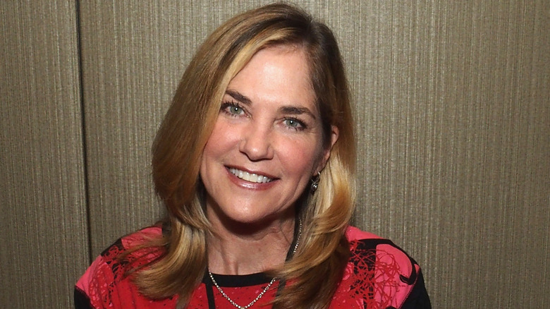 Kassie DePaiva smiling red shirt