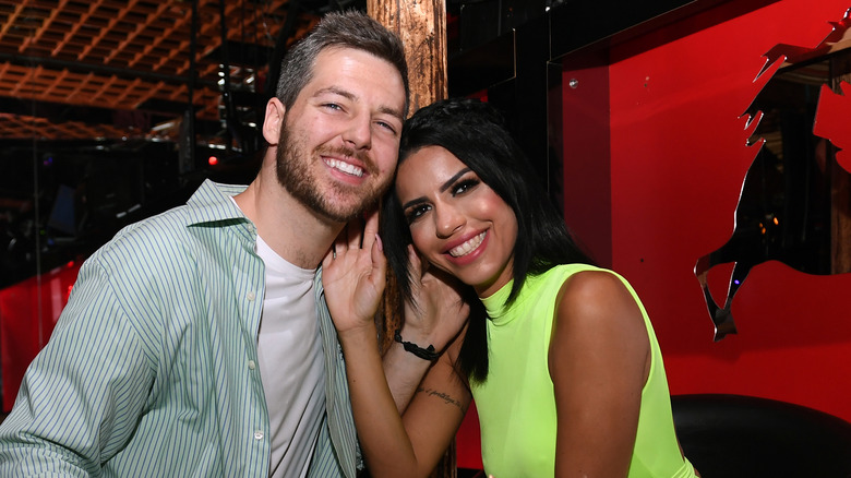 Eric and Larissa smile in 2019