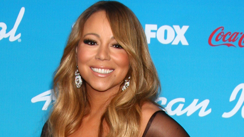 Mariah Carey smiling on the red carpet