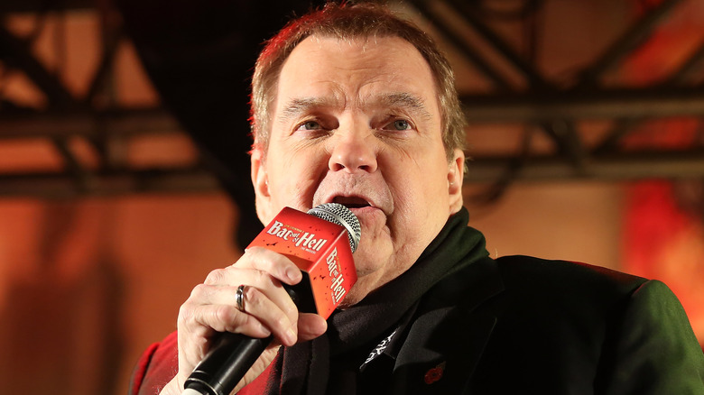 Meat Loaf speaking into a microphone