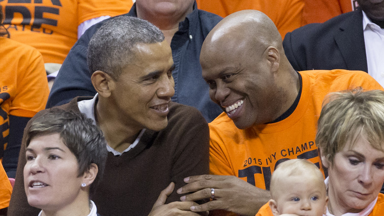 Barack Obama and Craig Robinson sitting together