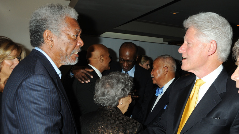 Morgan Freeman and Bill Clinton shake hands