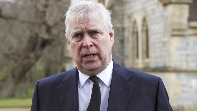 Prince Andrew reacts at an engagement