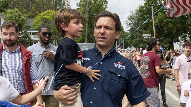 Ron DeSantis holding his son