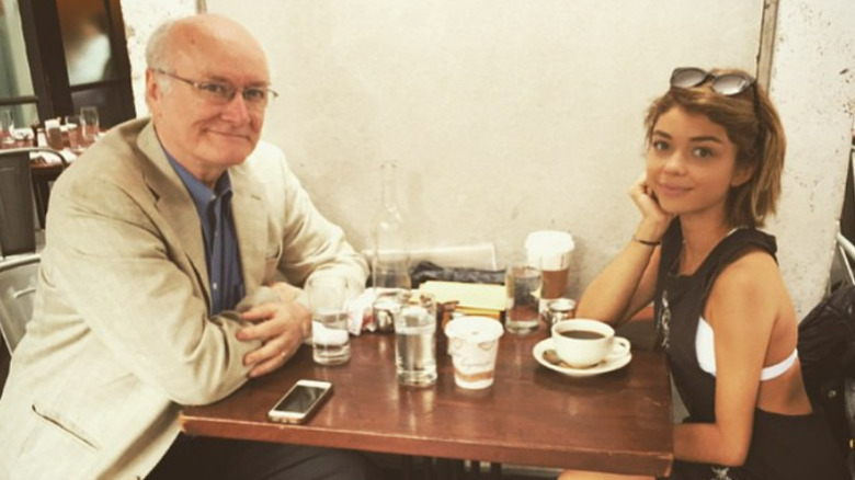 Sarah Hyland and her father seated at table