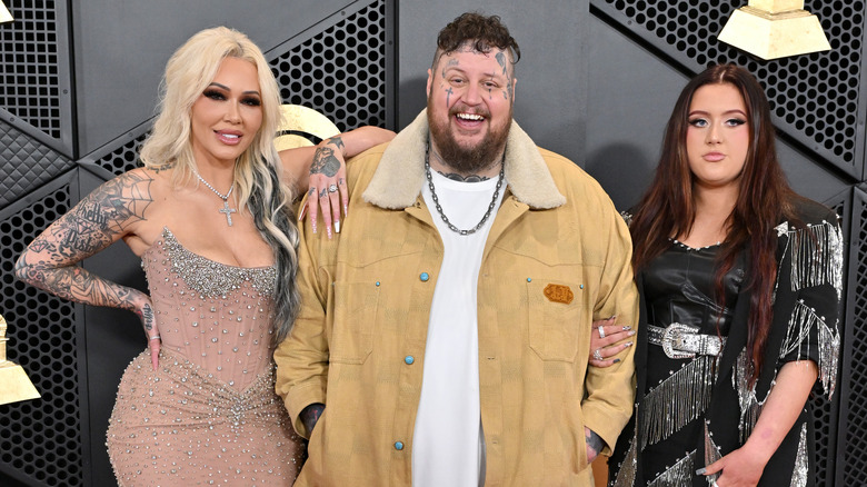  Bunnie Xo, Jelly Roll, and Bailee Ann posing on a red carpet