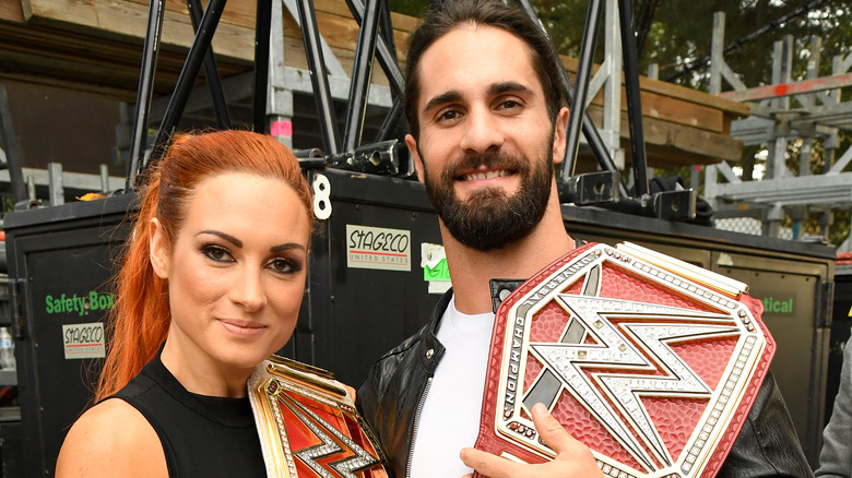 Becky Lynch Seth Rollins wrestling belts