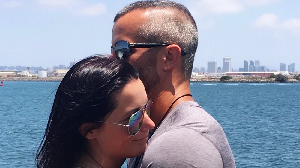 Shanann and Chris Watts embracing outside