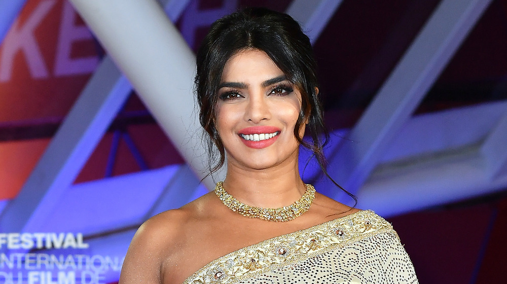 Priyanka Chopra smiling in sari-inspired gown