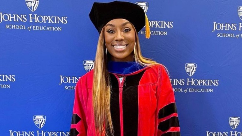 Wendy Osefo in a cap and gown