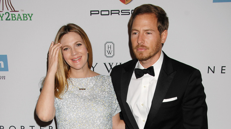 Drew Barrymore and Will Kopelman pose side by side