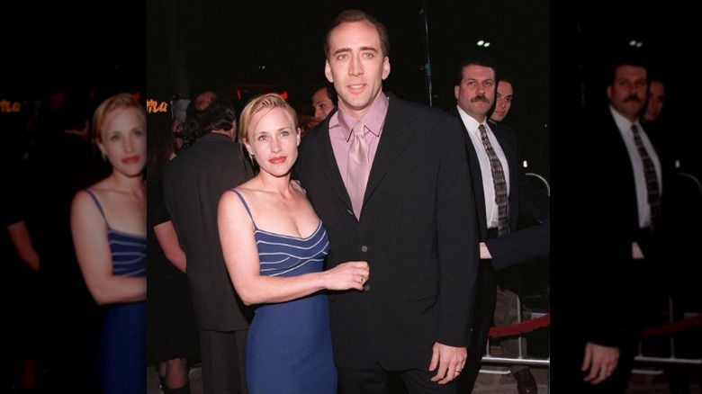 Nicolas Cage and Patricia Arquette pose on a red carpet