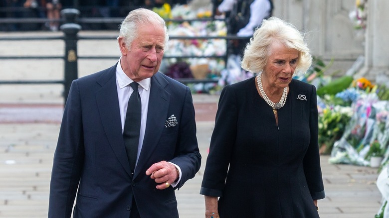 King Charles and Camilla walking