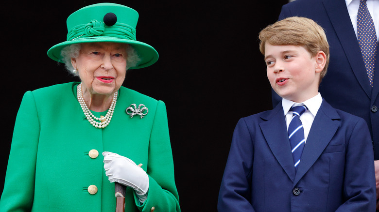 Queen Elizabeth and Prince George talking