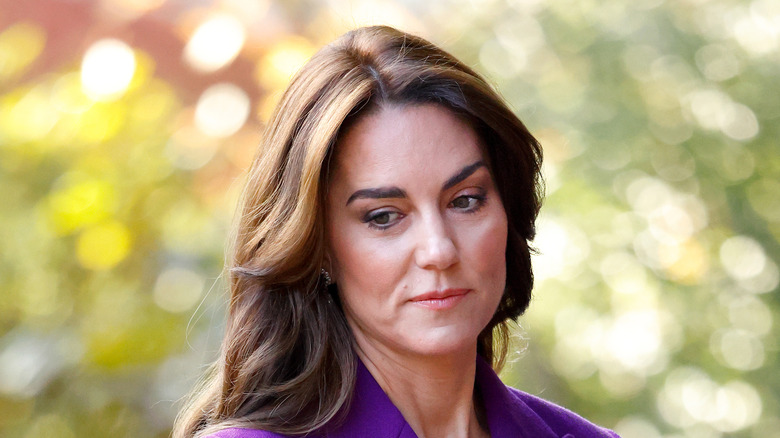 Kate Middleton in purple suit not smiling