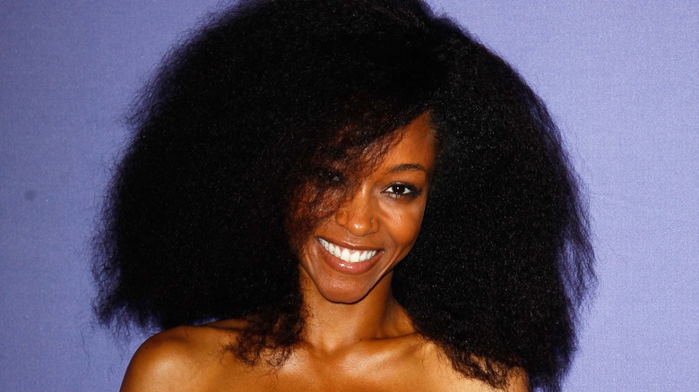 Yaya DaCosta smiles in natural hair