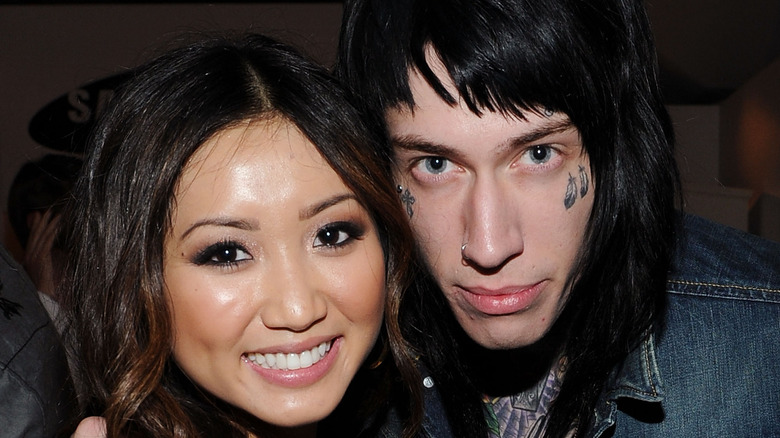 Brenda Song and Trace Cyrus grinning