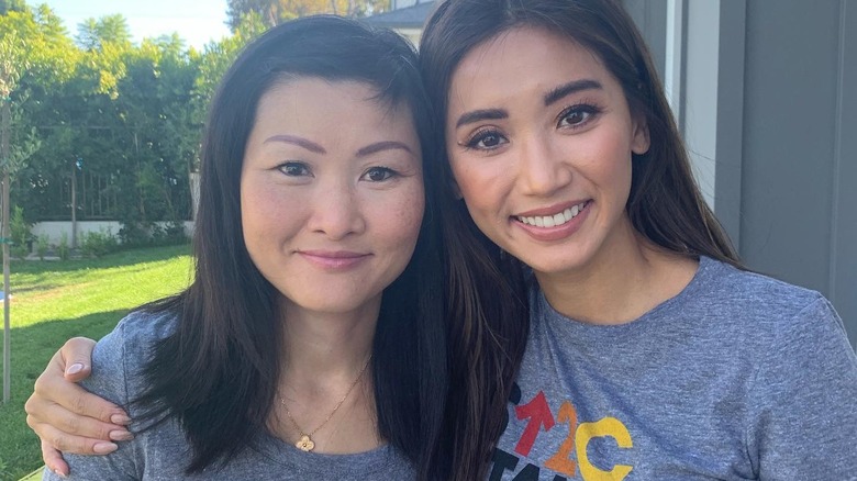 Brenda Song and her mom smiling