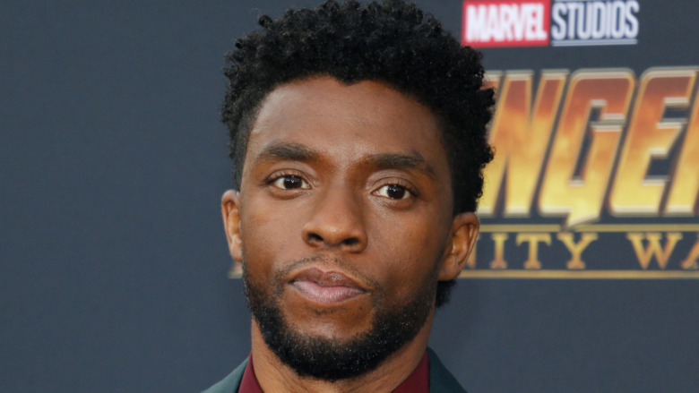 Chadwick Boseman with a serious expression