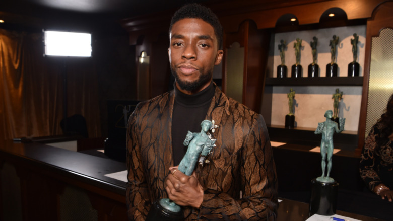 Chadwick Boseman with a SAG Award