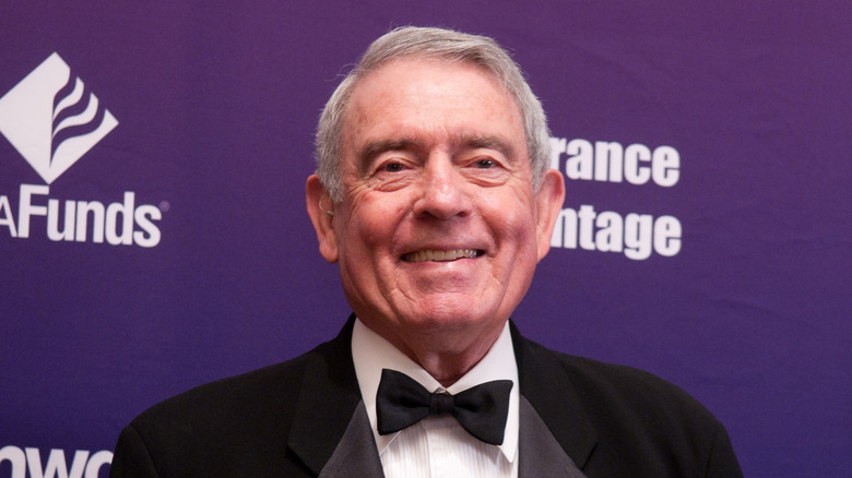 Dan Rather smiles, wearing a tuxedo