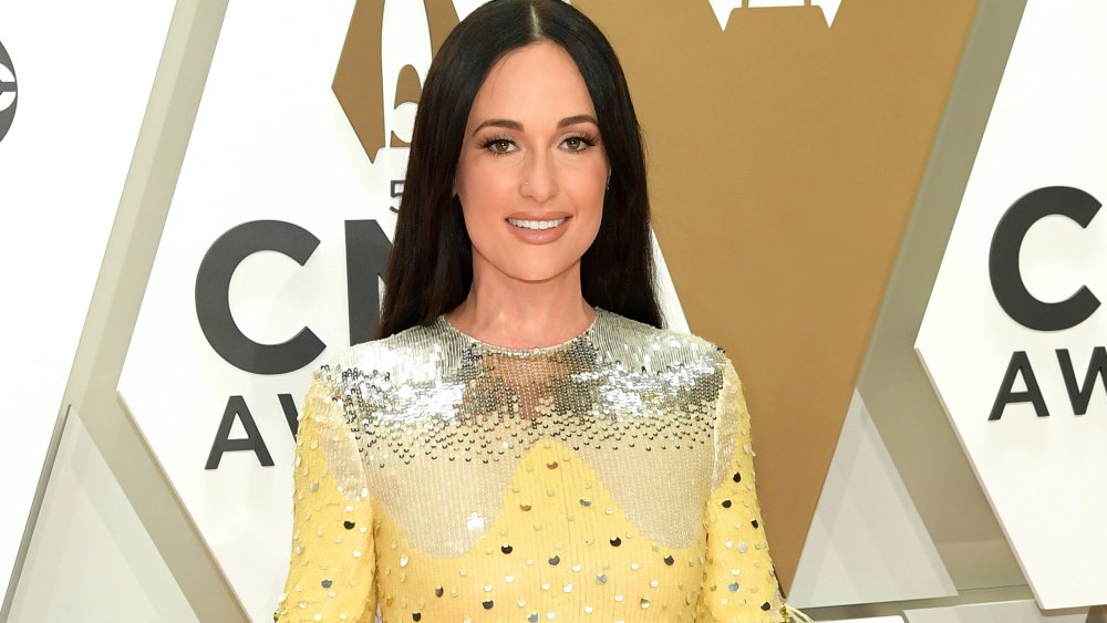 Kacey Musgraves in silver and yellow sequinned dress