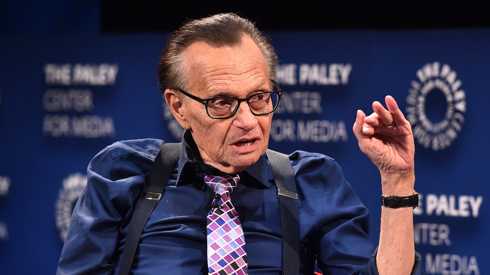 Larry King talking on stage