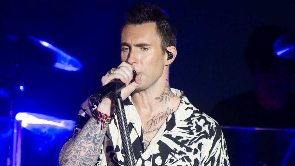 Adam Levine performing with Maroon 5 