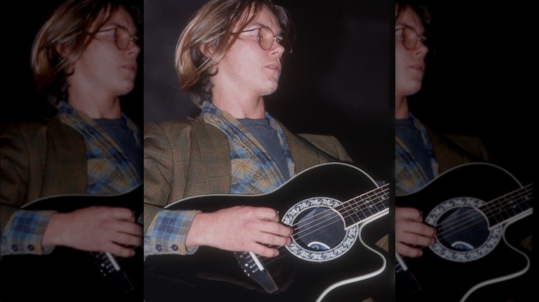 River Phoenix playing guitar