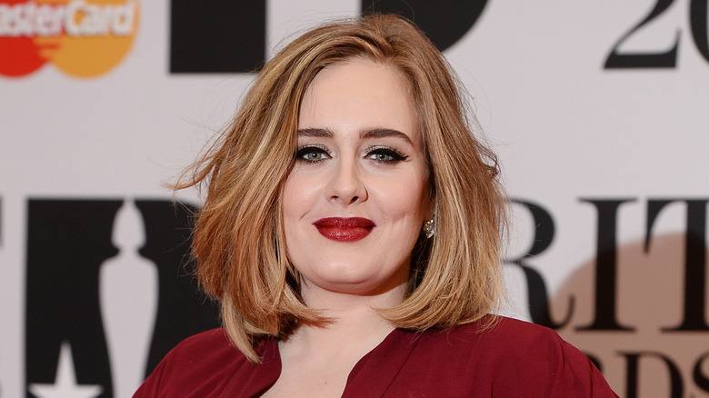 Adele in a red dress