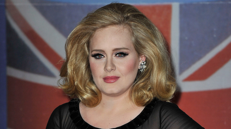 Adele in front of a British flag