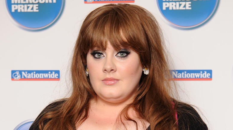 Adele holding an award