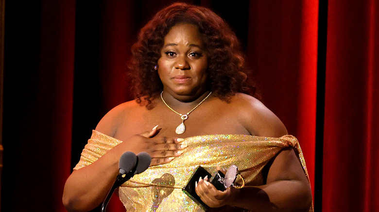 Alex Newell accepting their Tony Award