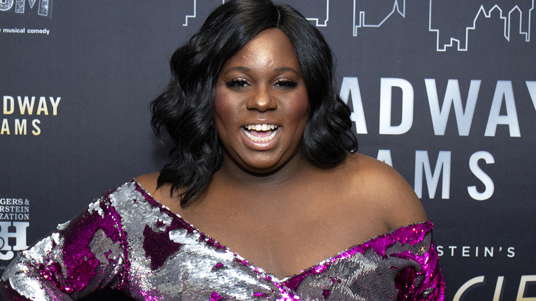 Alex Newell in purple gown