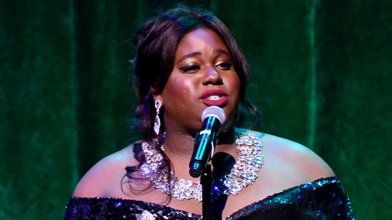 Alex Newell singing on stage