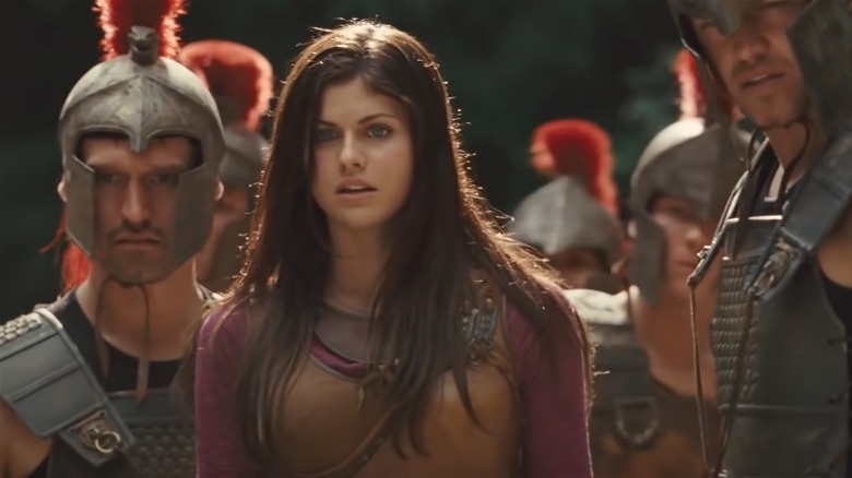 Alexandra Daddario flanked by soldiers