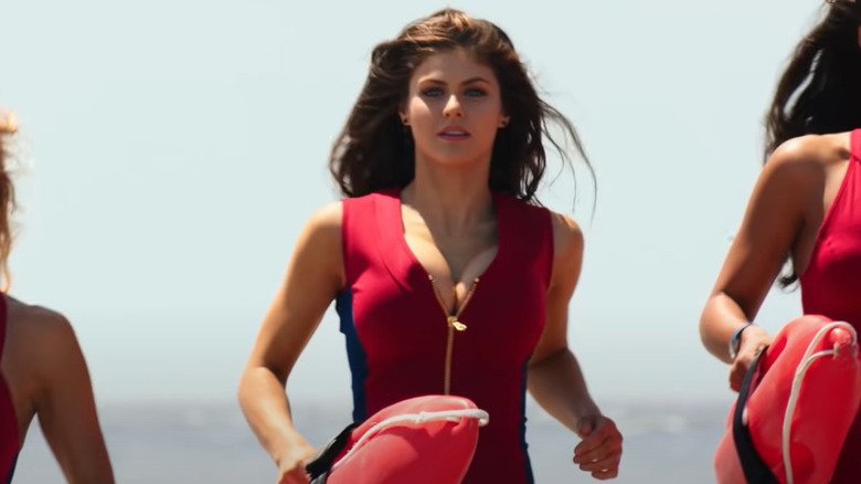 Alexandra Daddario running red swimsuit