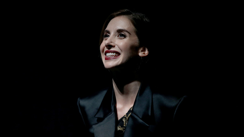 Alison Brie smiling low light