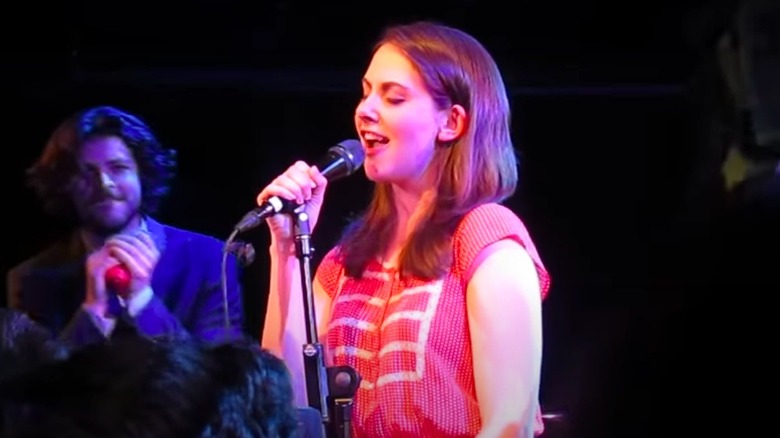 Alison Brie singing on stage