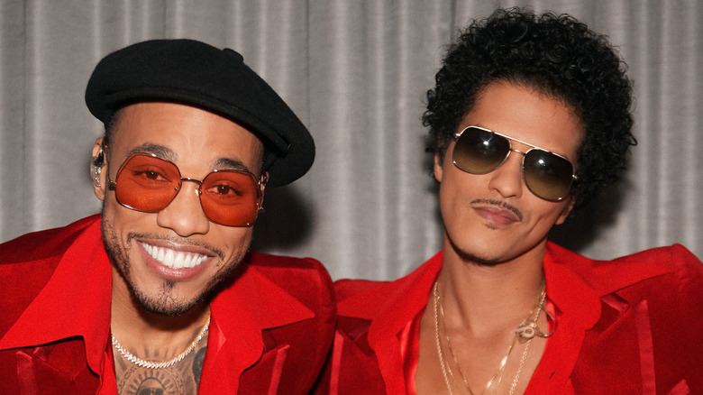 Anderson .Paak and Bruno Mars both in red suits