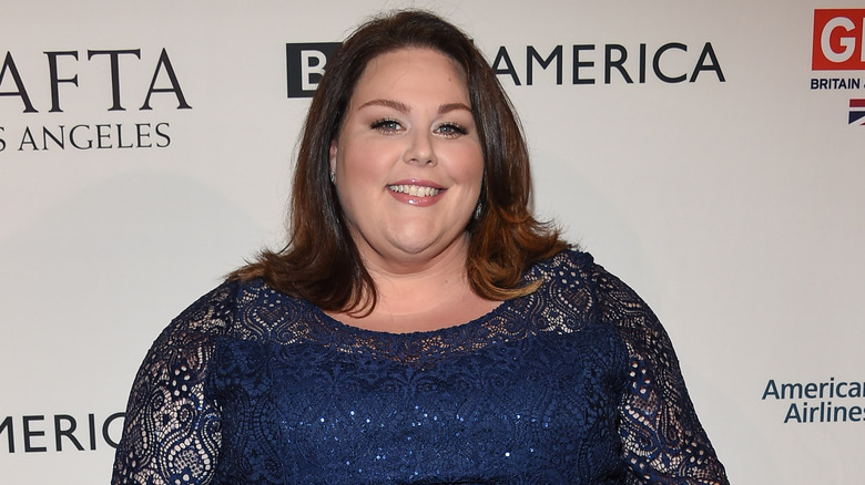 Chrissy Metz smiling in a blue dress