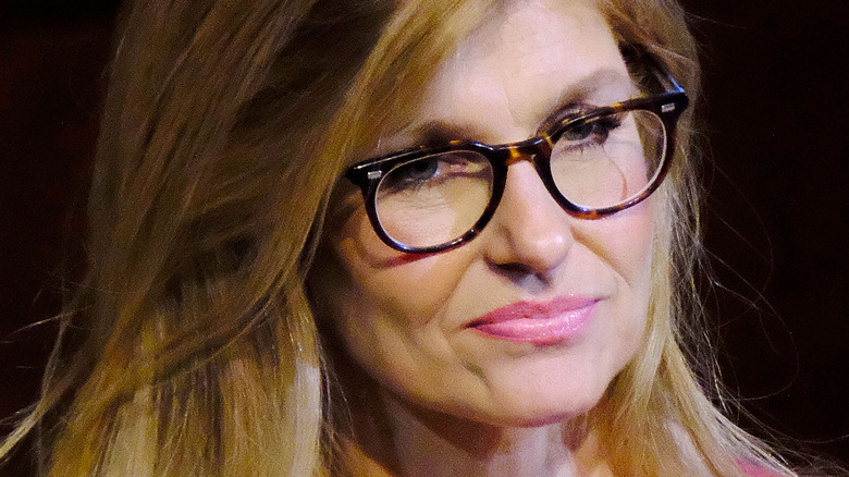 Connie Britton looks on