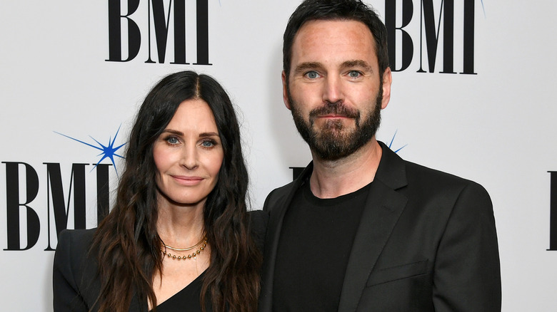 Courteney Cox and Johnny McDaid smiling 