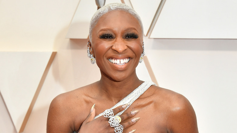 Cynthia Erivo with her hand on her chest