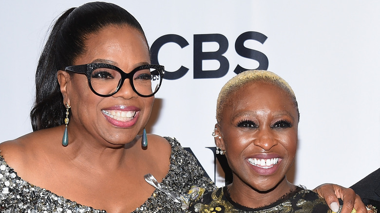 Oprah with her arm around Cynthia Erivo