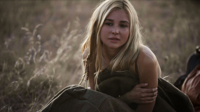 Isabel May in field with blanket