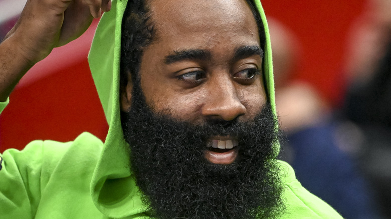 James Harden wearing green hoodie