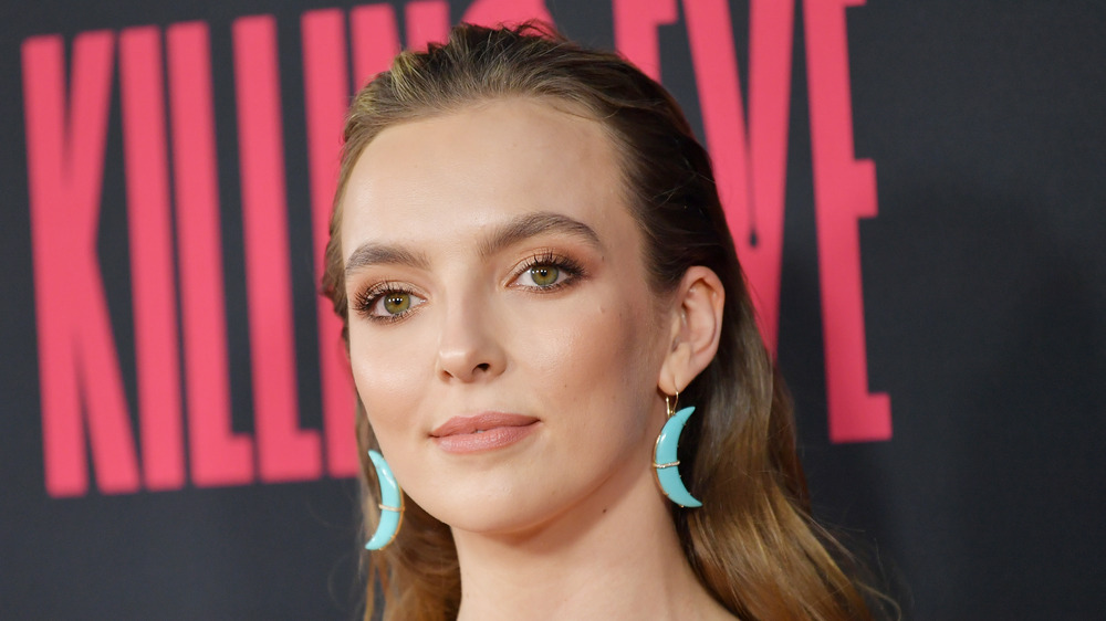 Jodie Comer smiling slightly