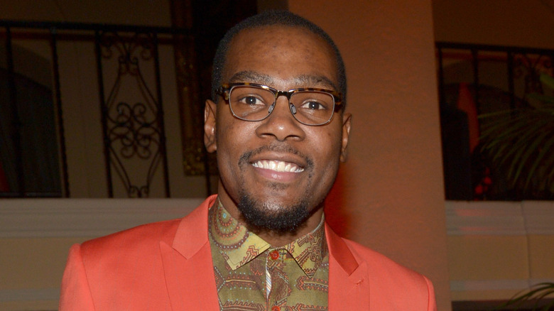 Kevin Durant wearing glasses, smiling